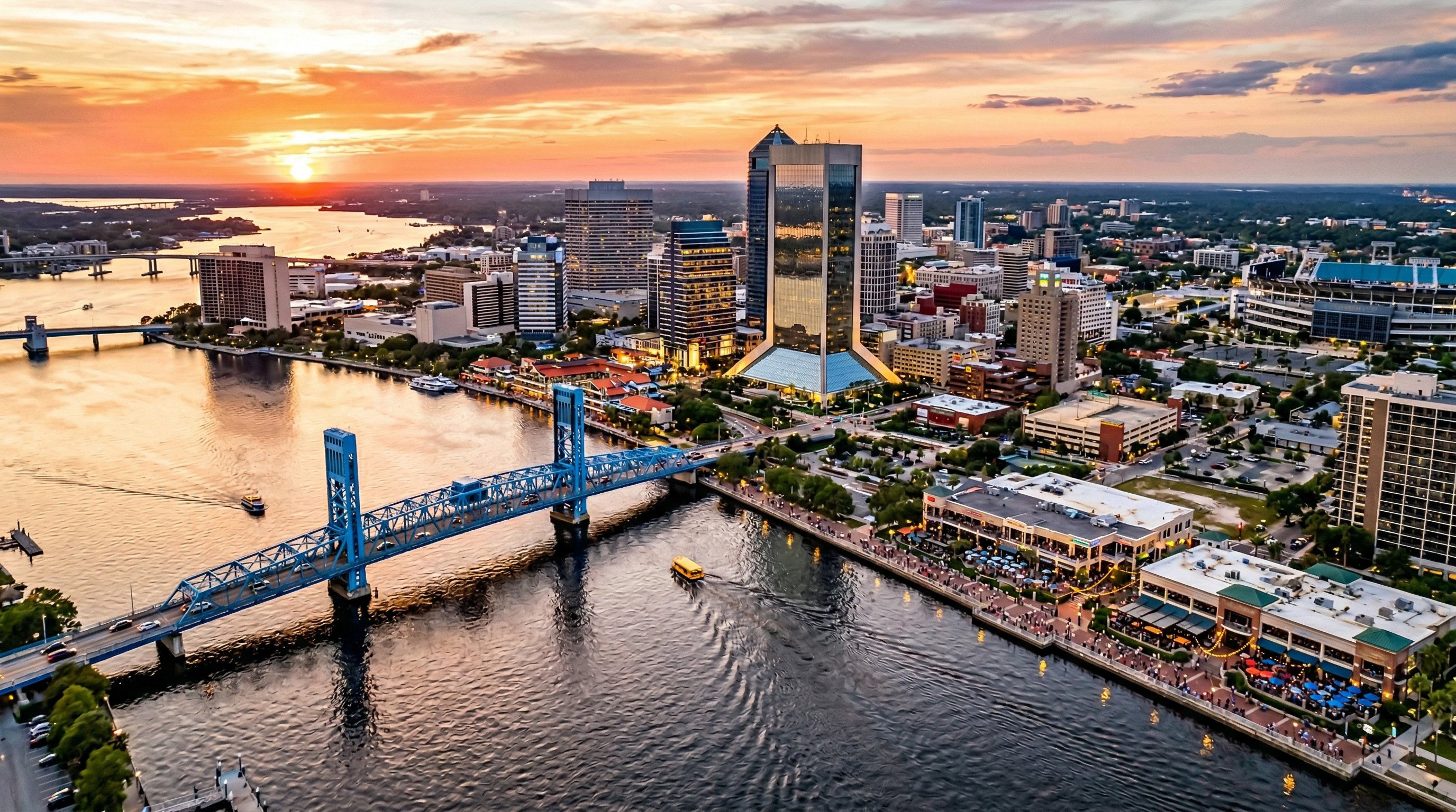 Aerial view of Jacksonville Florida downtown skyline along the St Johns River at golden hour